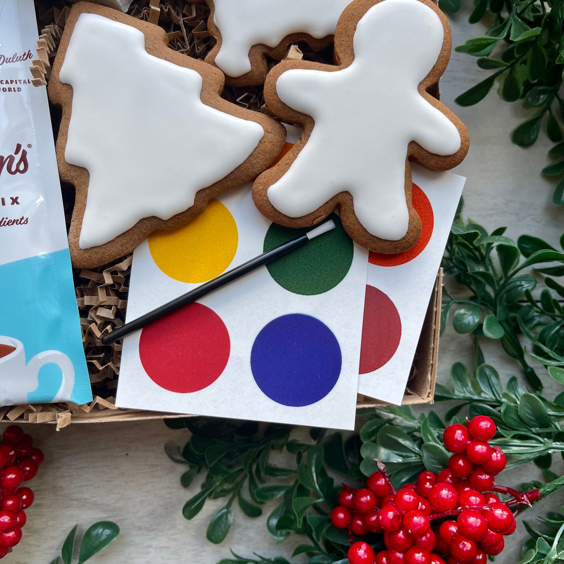 Gingerbread cookie decorating kit with handmade marshmallow, hot chocolate, and edible paint palettes.