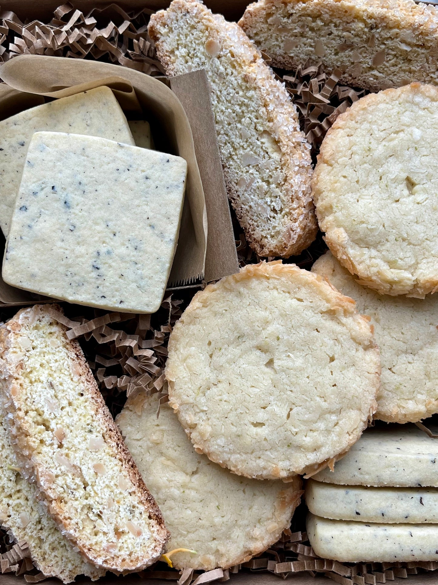 Citrus cookies gift box with earl grey shortbread, toasted coconut lime shortbread, and almond orange biscotti.