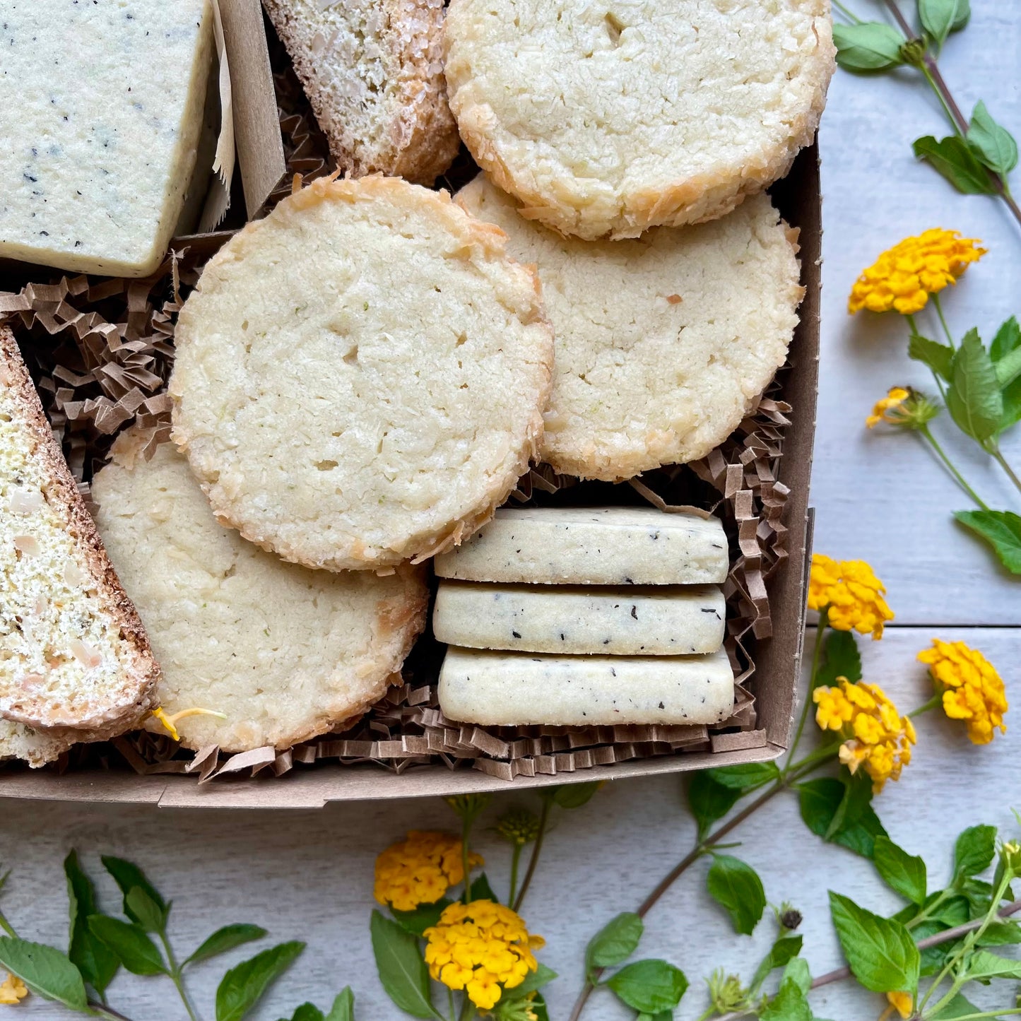 Citrus cookies gift box with earl grey shortbread, toasted coconut lime shortbread, and almond orange biscotti.