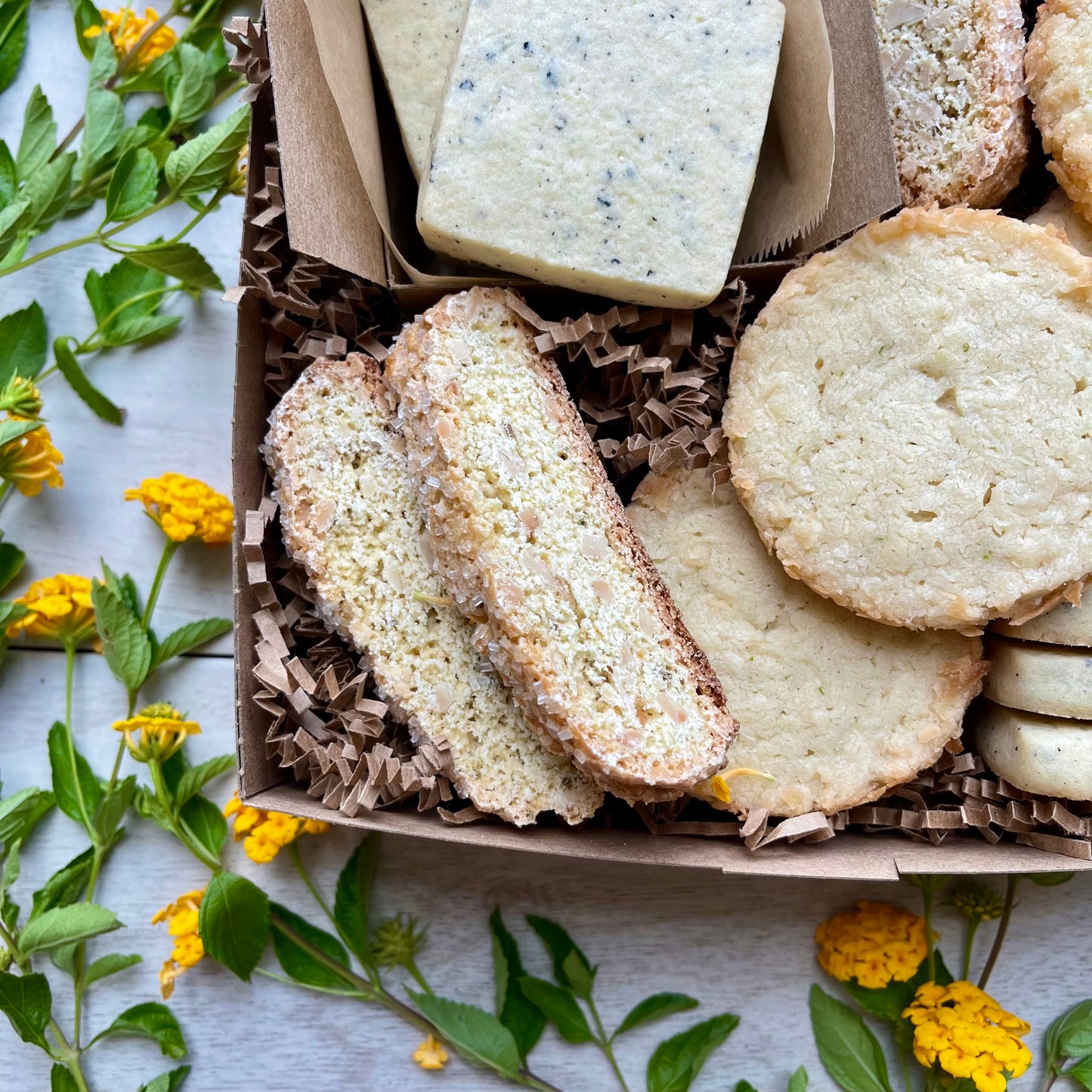 Citrus cookies gift box with earl grey shortbread, toasted coconut lime shortbread, and almond orange biscotti.