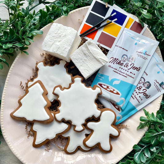 Gingerbread cookie decorating kit with handmade marshmallow, hot chocolate, and edible paint palettes.
