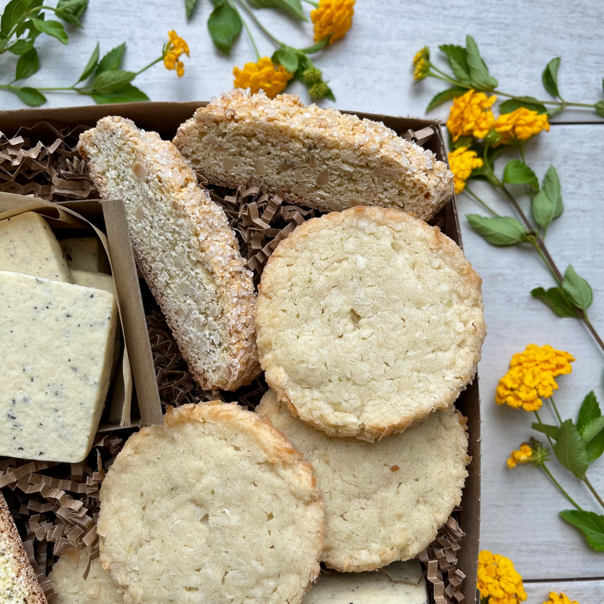 Citrus cookies gift box with earl grey shortbread, toasted coconut lime shortbread, and almond orange biscotti.